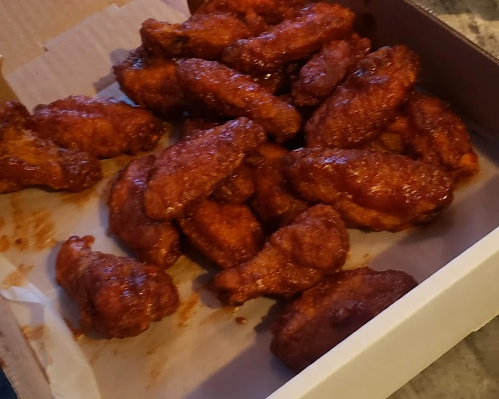 Chicken wings with dipping sauce at Ancaster Pizza, Ancaster ON